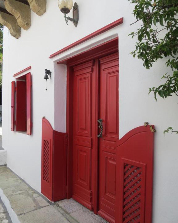 Skyros Town House | Red Windows to Blue Sky
