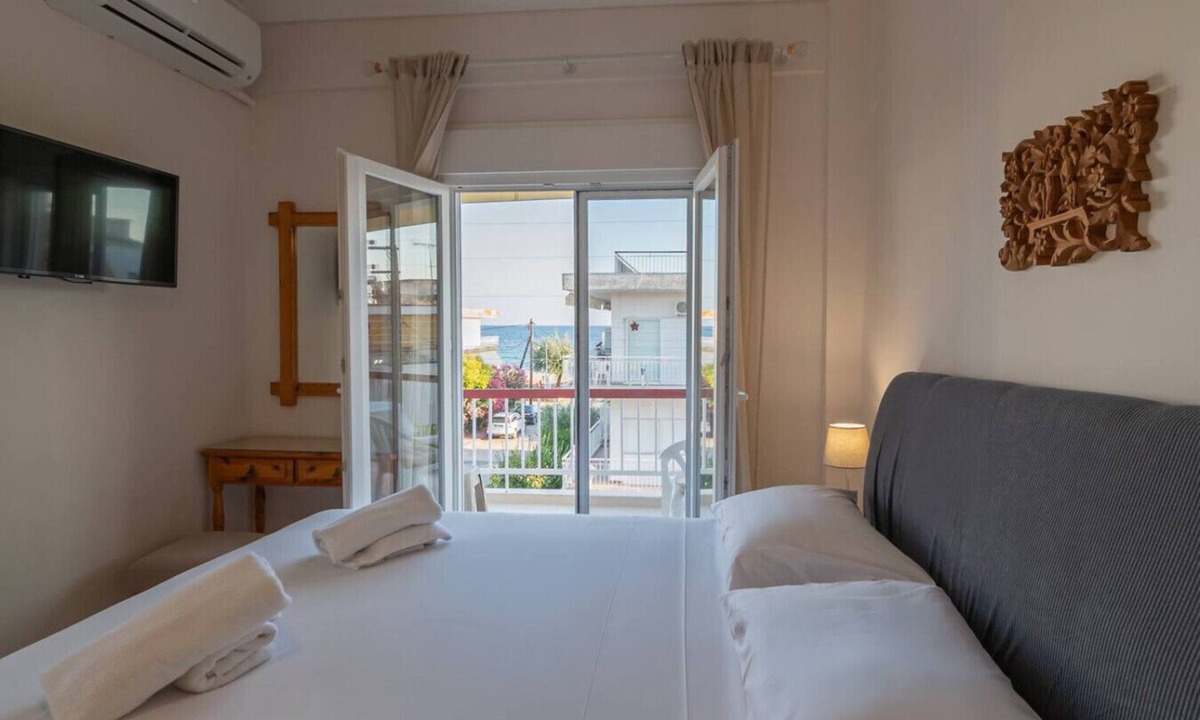 Paralia Dionysiou Apartment | Thanos and Sofia by RentalsPro