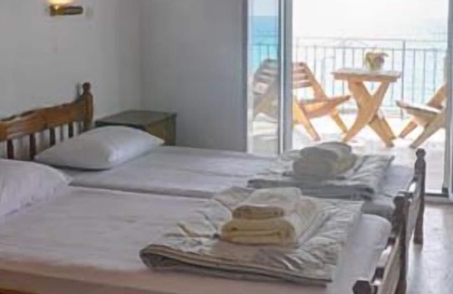 Agios Georgios Pagon Apartment | Arista Apartment 2 - with sea view right on the beach of Agios Georgios Pagon