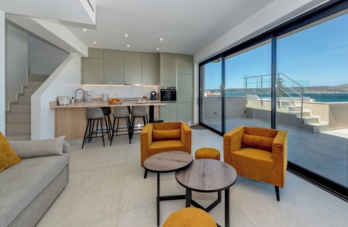 Kalyves Apartment | 2 Minute walk to the beach and supermarket, with covered parking & lift access.