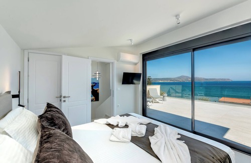 Kalyves Apartment | 2 Minute walk to the beach and supermarket, with covered parking & lift access.