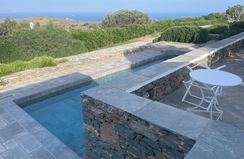 Platis Gialos House | A quiet Cycladic-style family home with a pool and an exceptional ocean view.