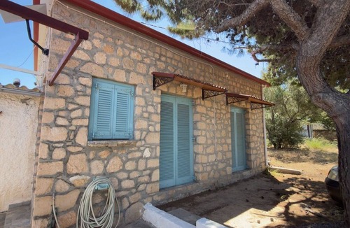 Aegina House | A stone retreat 40m from the sea, in a private 1,200m² estate on Aegina island.