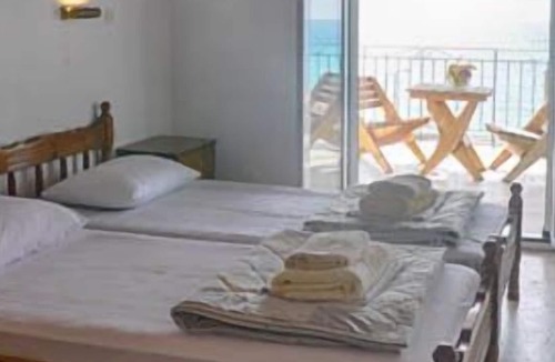Agios Georgios Pagon Apartment | Arista Apartment 2 - with sea view right on the beach of Agios Georgios Pagon