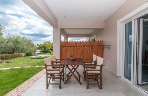 Alonia Apartment | Nestled on the ground floor with direct garden access amidst olive trees