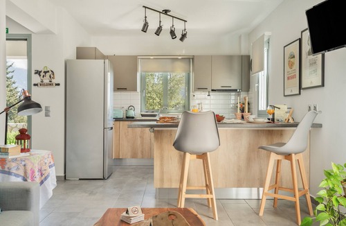 Kourkoumelata Apartment | Rose Garden Home Apartment with Balcony, Wi-Fi, and Air Conditioning