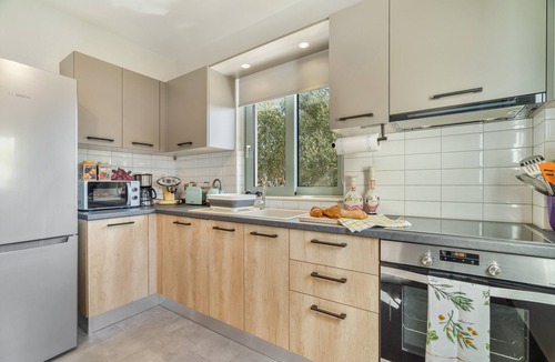 Kourkoumelata Apartment | Rose Garden Home Apartment with Balcony, Wi-Fi, and Air Conditioning