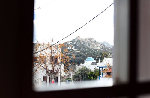 Naxos Apartment | The house is located in the central square of the historical village Kynidaros