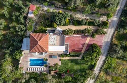 Houdetsi Villa | Tsourlakis Residence, A Tranquil Family Oasis with Pool, By ThinkVilla