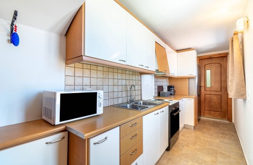 Afionas House | Vacation Home "Tsoukali House" with Sea View, Private Terrace & Wi-Fi