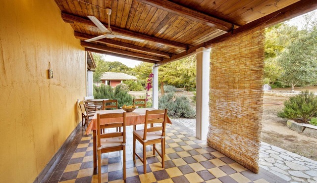 Self catered Daphnes cottage #3 with large veranda and garden near the beach.