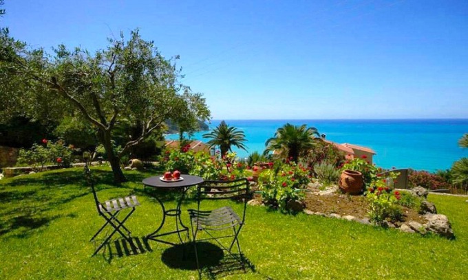 Agios Gordios Apartment | Natalia Apartment A with panoramic sea views of Agios Gordios bay