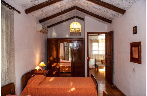 Paleros Villa | Traditional, rustic, seafront villa, just steps away from the beach.