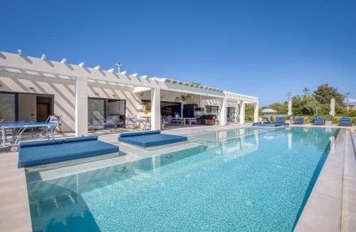 Almiros Beach Villa | Villa Serenissima - Beachfront Villa with Indoor & Outdoor Pools and Gym by Posarelli Villas